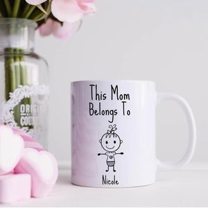 This Mom Belongs To ceramic coffee mugs.